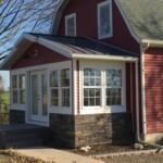 Rebuilt porch w/ steel roof, Versetta stone, fiberglass door and composite deck